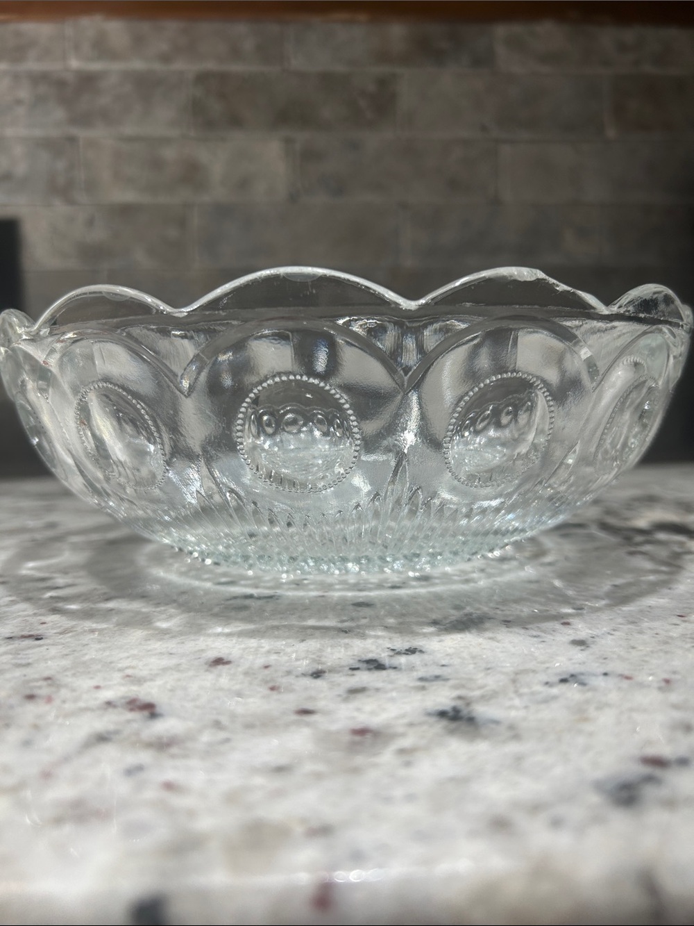 Scalloped Clear Glass Serving Bowl with Raised Medallion Design